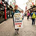 girl holding a sign