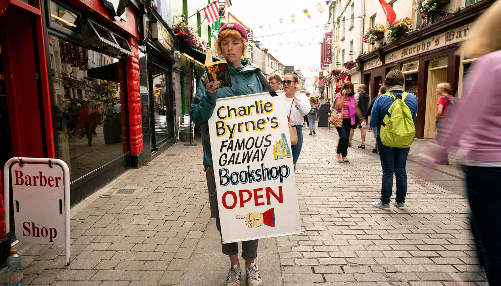 girl holding a sign